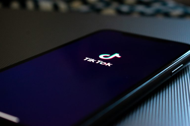 black smartphone displaying Tik Tok logo